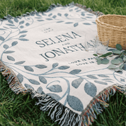 Personalized picnic blanket with names and leaf design on grass