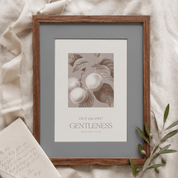 Framed artwork with 'Gentleness' text on a textured surface
