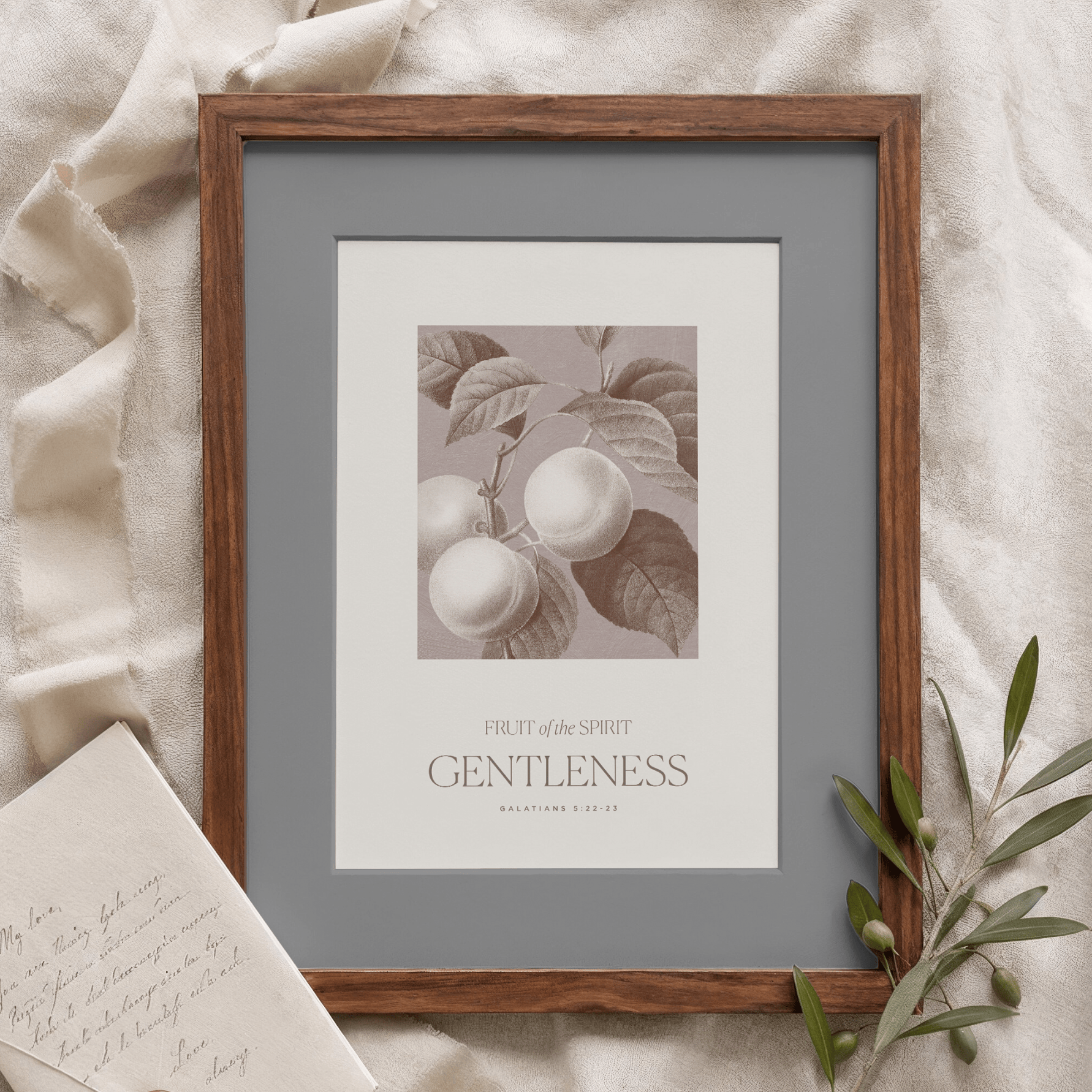 Framed artwork with 'Gentleness' text on a textured surface