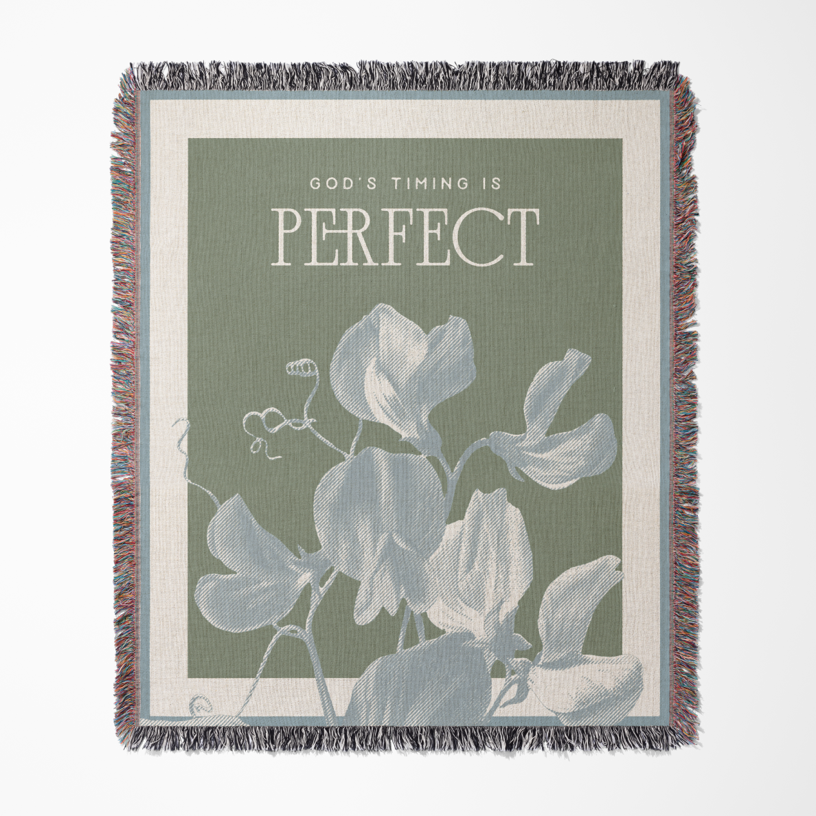 Throw blanket with floral design and motivational quote on a white background