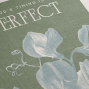 Decorative mat with floral design and text on a green background