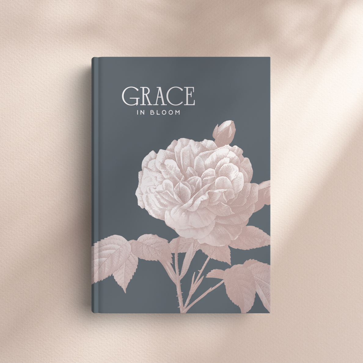 Book titled 'Grace in Bloom' with floral design on a beige background