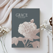 Book titled 'Grace in Bloom' with floral design on a light background