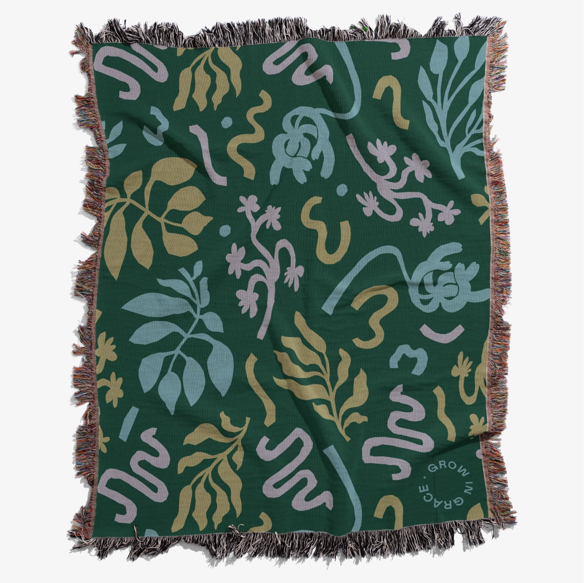 Grow in Grace Woven Blanket on Floor