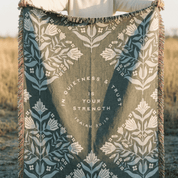 In Quietness and Trust woven blanket folded showing geometric diamond pattern reverse side