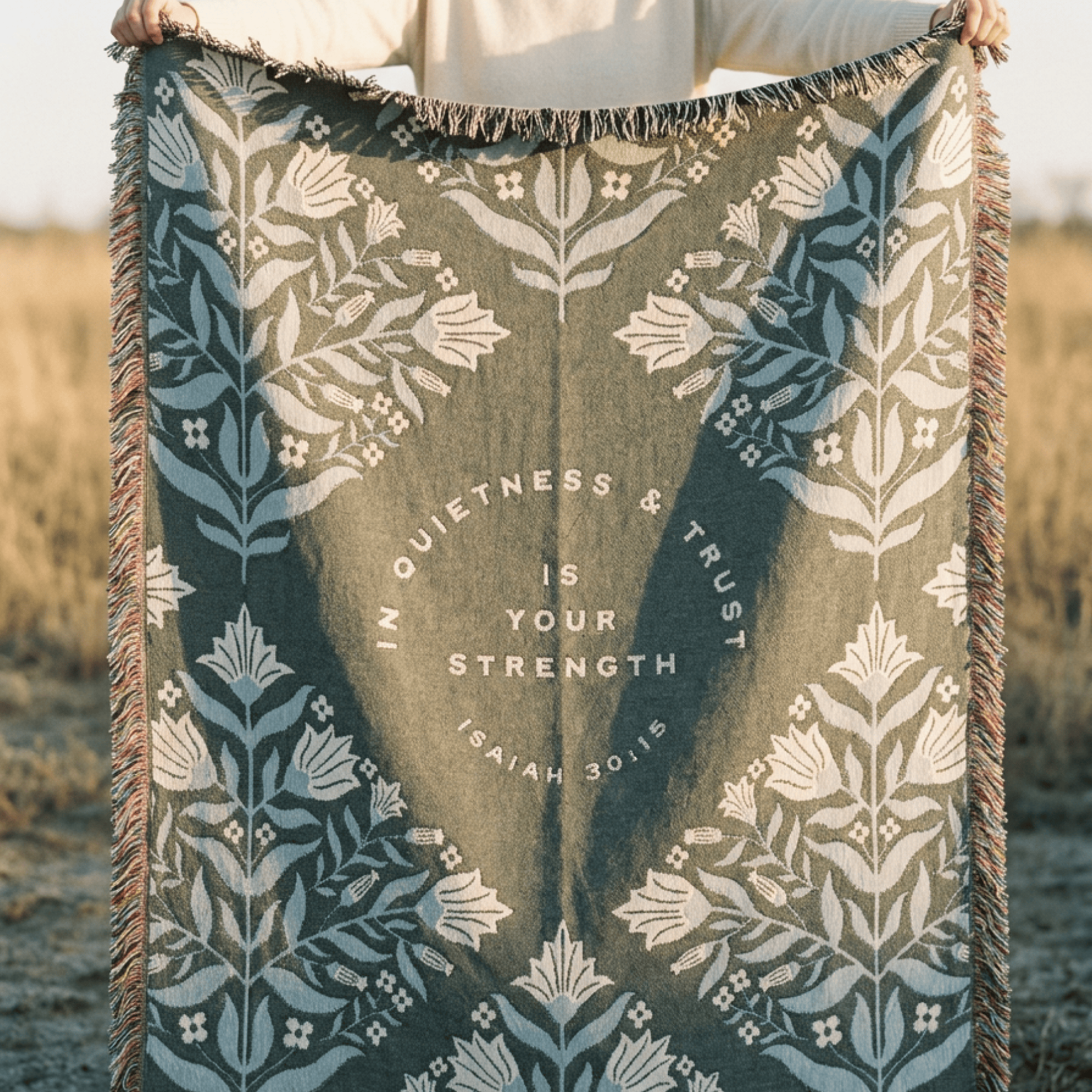 In Quietness and Trust woven blanket folded showing geometric diamond pattern reverse side