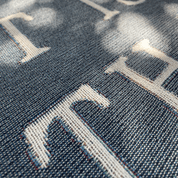 Close-up of denim fabric with a patterned design