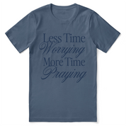 Christian t-shirt with the phrase “Less Worrying, More Praying” in modern script; unisex faith tee promoting peace and prayer over anxiety.