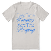 Christian t-shirt with the phrase “Less Worrying, More Praying” in modern script; unisex faith tee promoting peace and prayer over anxiety.
