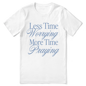 Christian t-shirt with the phrase “Less Worrying, More Praying” in modern script; unisex faith tee promoting peace and prayer over anxiety.