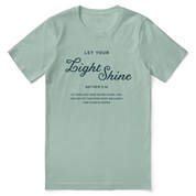 Christian t-shirt with the phrase "Let Your Light Shine" in bold script, designed to inspire faith and positivity.