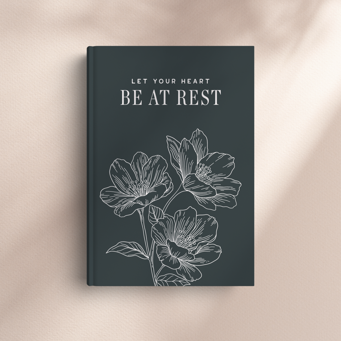 Book cover with floral design and text 'Let your heart be at rest' on a beige background