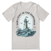 Christian t-shirt with the phrase “Light in the Darkness” in bold typography; unisex faith tee symbolizing hope, truth, and God’s presence in dark times.