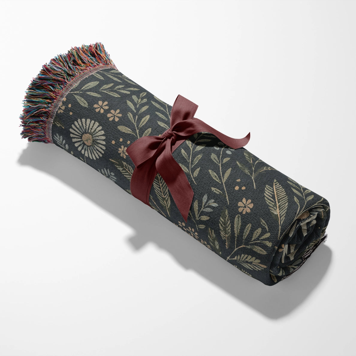 Faith-inspired woven blanket with floral patterns and the phrase “Rooted in Christ,” made from soft cotton—Christian home decor and gift.