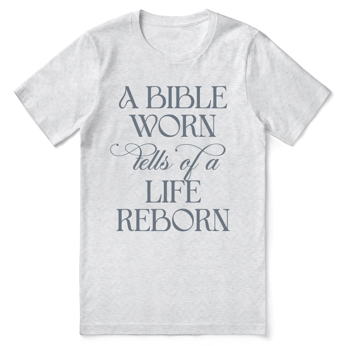 Christian t-shirt with the phrase “A Bible Worn Tells of a Life Reborn”; unisex cotton tee celebrating transformation through God's Word.