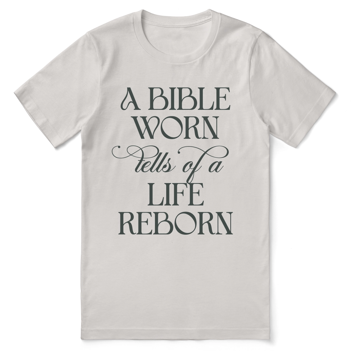 Christian t-shirt with the phrase “A Bible Worn Tells of a Life Reborn”; unisex cotton tee celebrating transformation through God's Word.