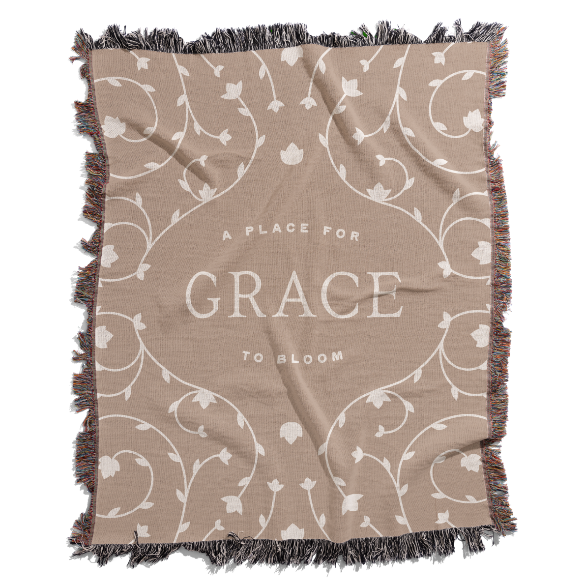 Beige blanket with floral patterns and 'A Place for Grace to Bloom' text