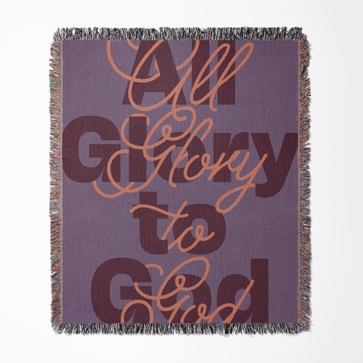 Blanket with 'All Glory to God' text on a purple background
