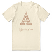 Beige t-shirt with decorative letter 'A' and text on a white background