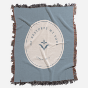 Blue blanket with a circular design and text on a white background