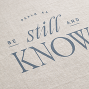 Text 'Be still and know' with 'Psalm 46' on a textured beige background