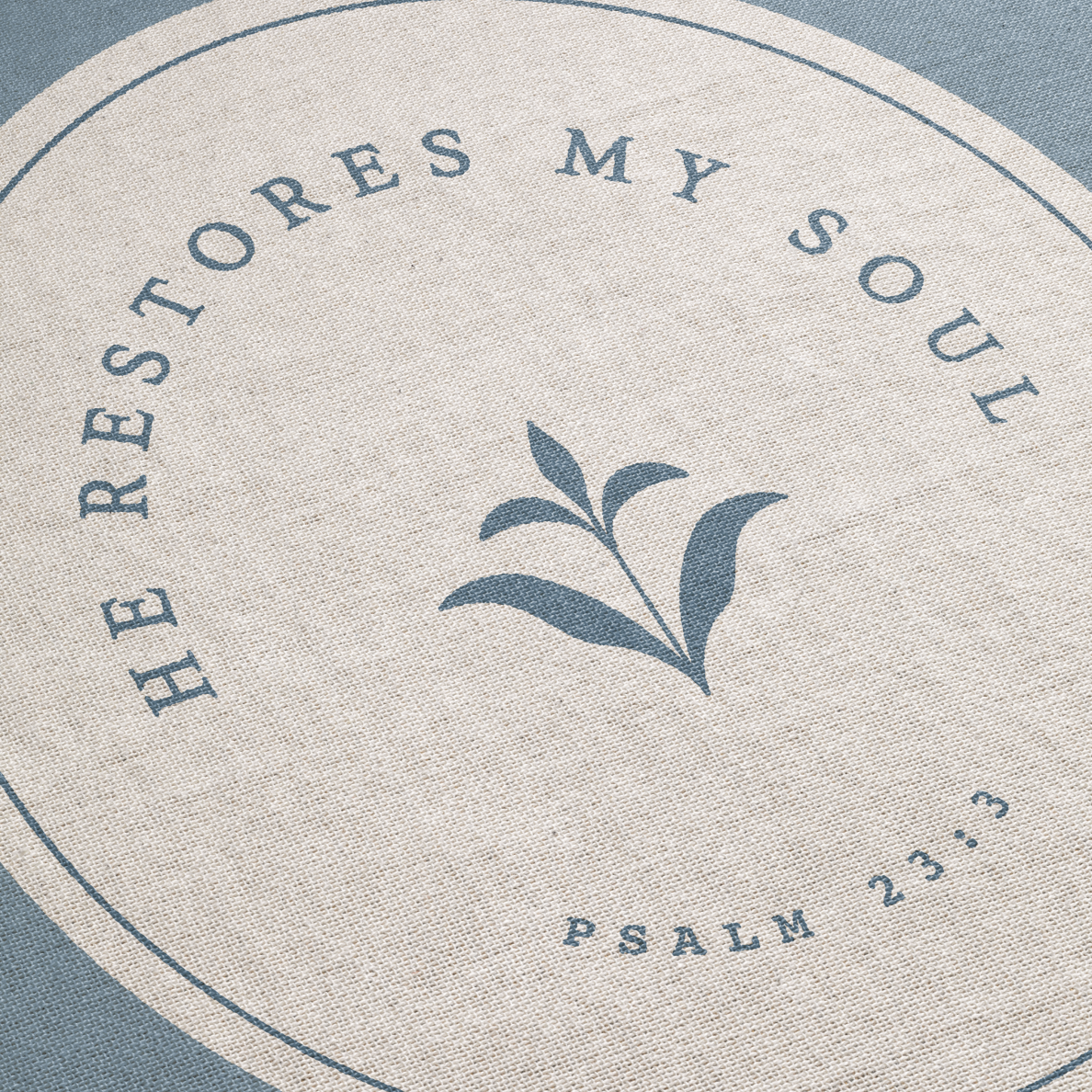 Circular design with text 'He restores my soul' from Psalm 23:3 on a textured background.