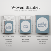 Woven blanket with size options displayed on a bed for reference.