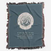 Blue blanket with a central design and text on a white background