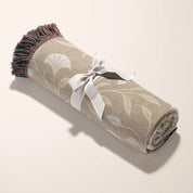 Cream-colored woven blanket with the phrase “Be still and know” from Psalm 46, made of 100% cotton with fringe; a peaceful Christian gift for nurseries or weddings.