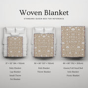 Cream-colored woven blanket with the phrase “Be still and know” from Psalm 46, made of 100% cotton with fringe; a peaceful Christian gift for nurseries or weddings.