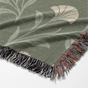 Soft green woven blanket with the phrase “Be still and know” from Psalm 46, 100% cotton with fringe; a peaceful Christian gift for weddings, nurseries, or devotion spaces.