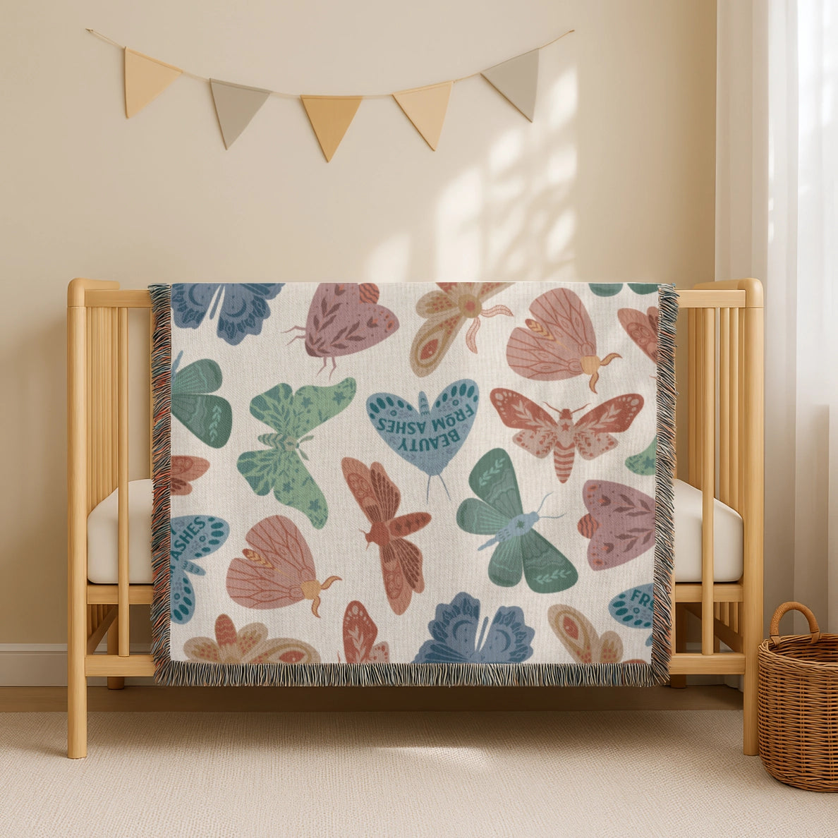 Faith-inspired woven blanket with hand-drawn butterflies and moths on a soft light background, made from 100% cotton with colorful fringed edges—Christian home decor.
