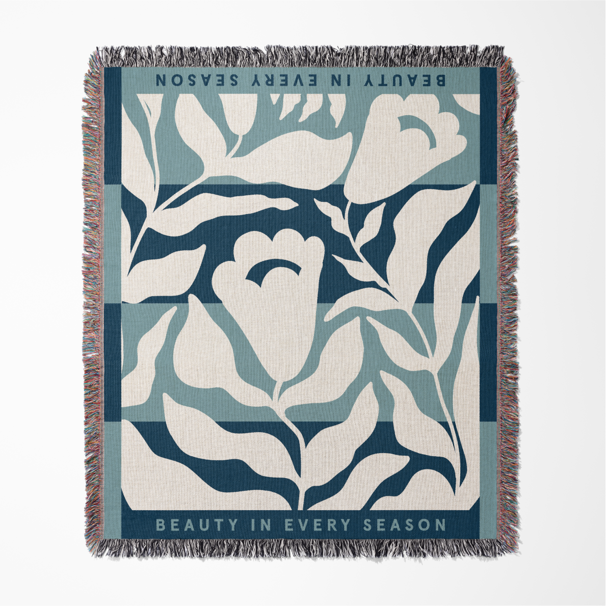 Floral patterned throw blanket with text on a white background