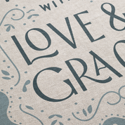 Textured fabric with 'LOVE & GRACE' printed in stylized letters.