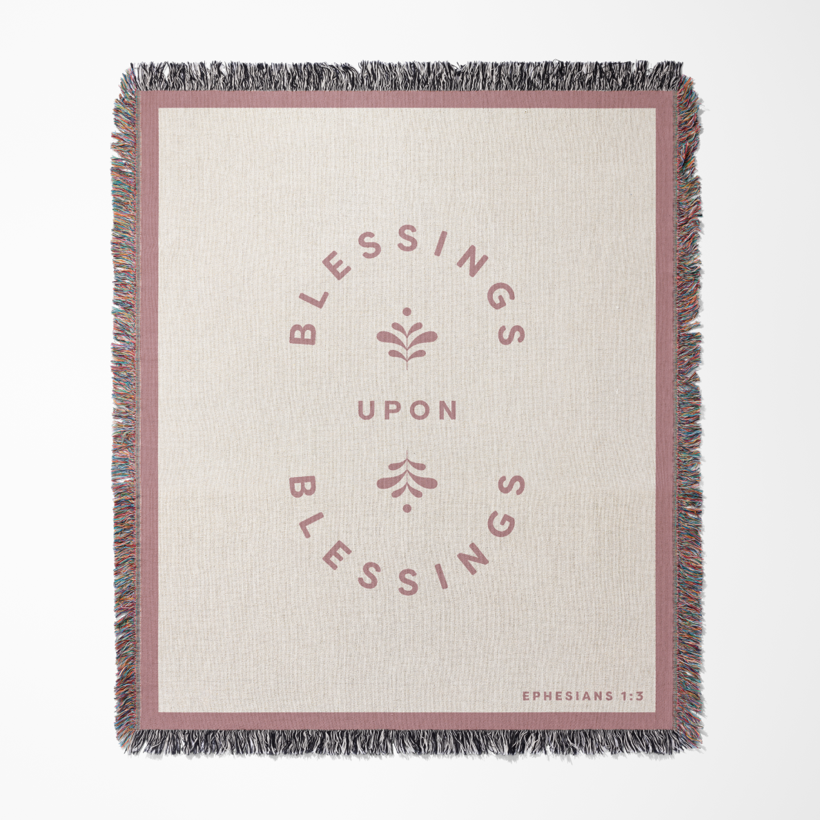 Blanket with 'Blessings Upon Blessings' text and floral design on a white background