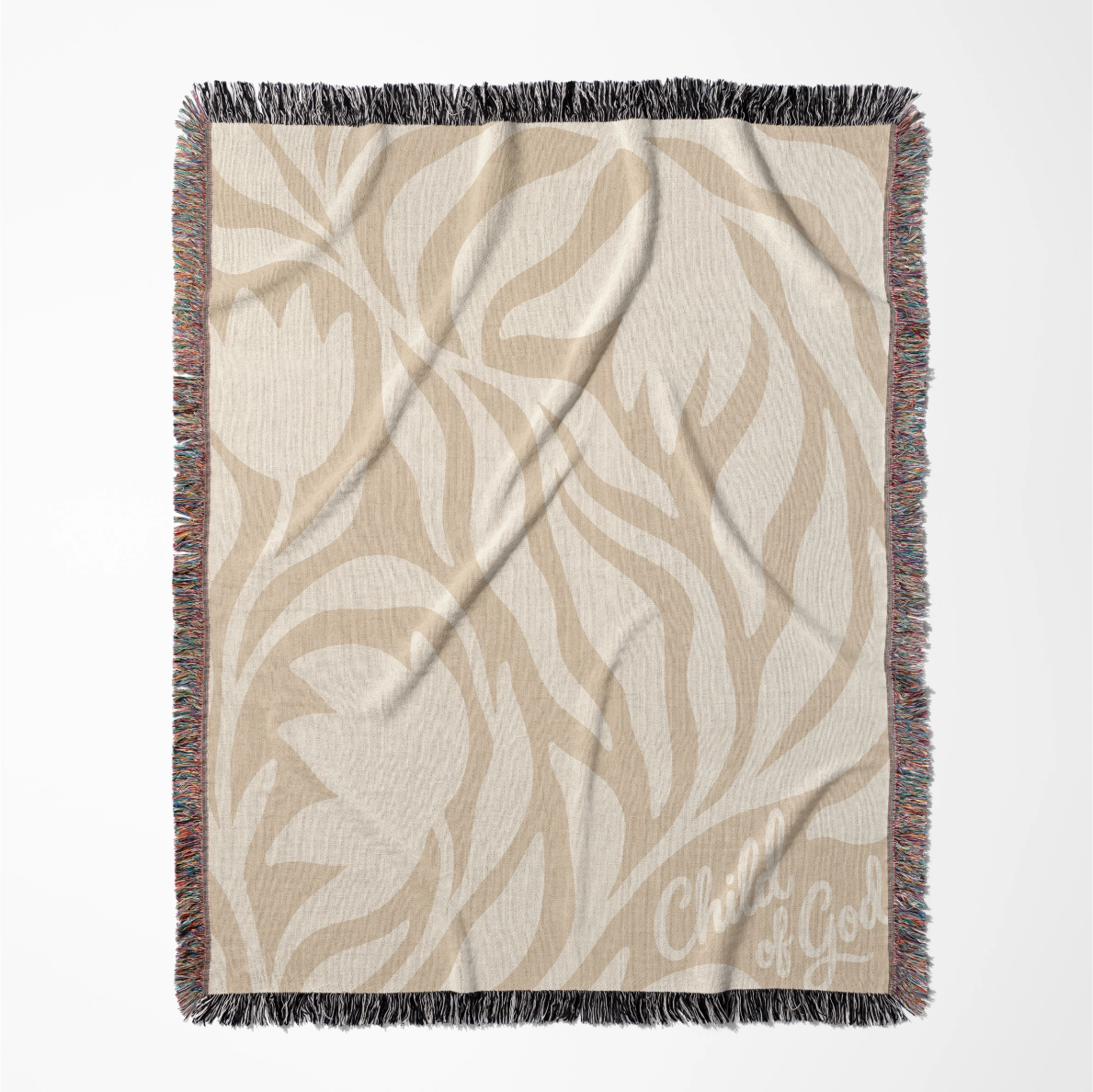 Neutral-toned woven blanket with “Child of God” text and delicate cream foliage design; 100% cotton with fringe, perfect for nurseries, baby gifts, or faith-inspired décor.