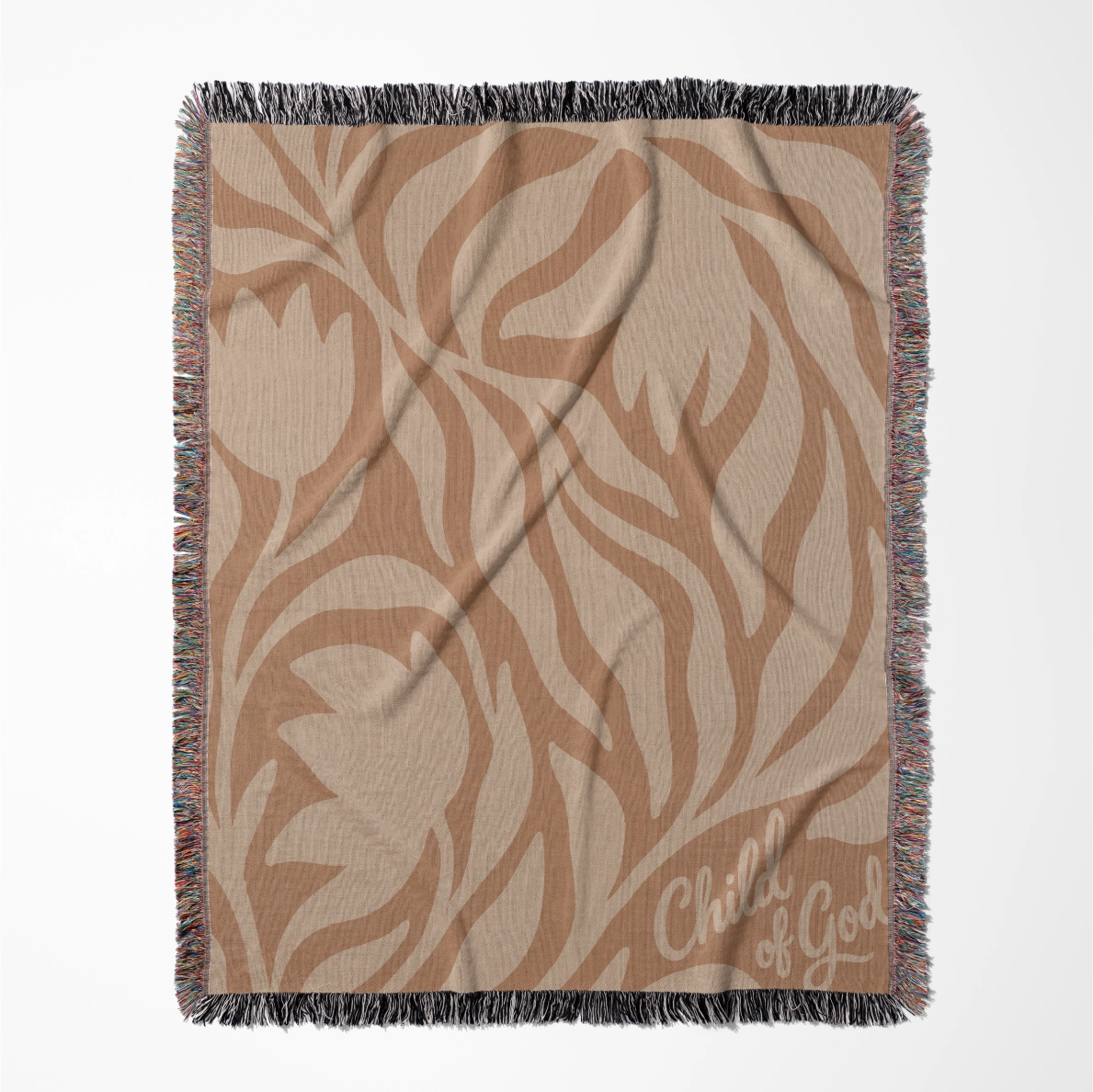 Woven cotton blanket with “Child of God” text and sunset-colored foliage design, finished with fringe; perfect for Christian nursery, baby gift, or faith-based home décor.