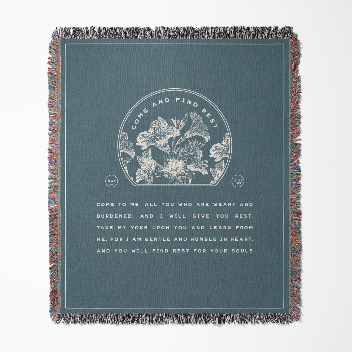 Blanket with floral design and text on a blue background