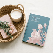 Created for a Purpose faith journal with candle and greenery in wicker tray lifestyle flat lay