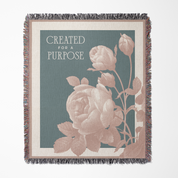 Throw blanket with floral design and 'Created for a Purpose' text on a white background