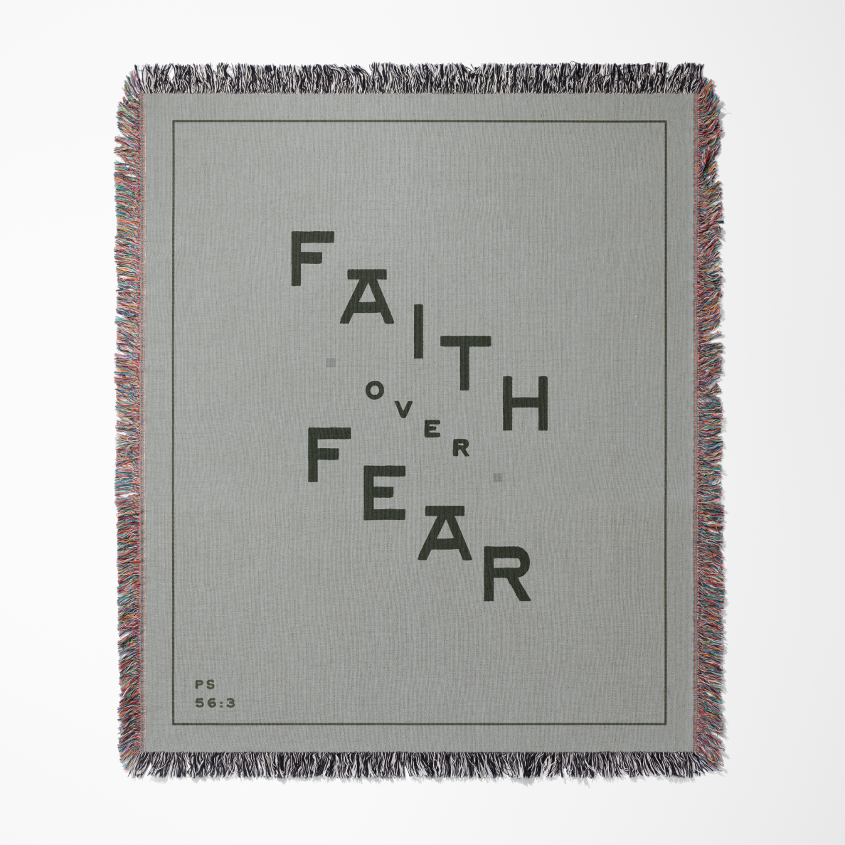 Gray blanket with 'Faith Over Fear' text on a white background