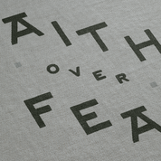 Gray fabric with black text 'FAITH OVER FEAR' printed on it