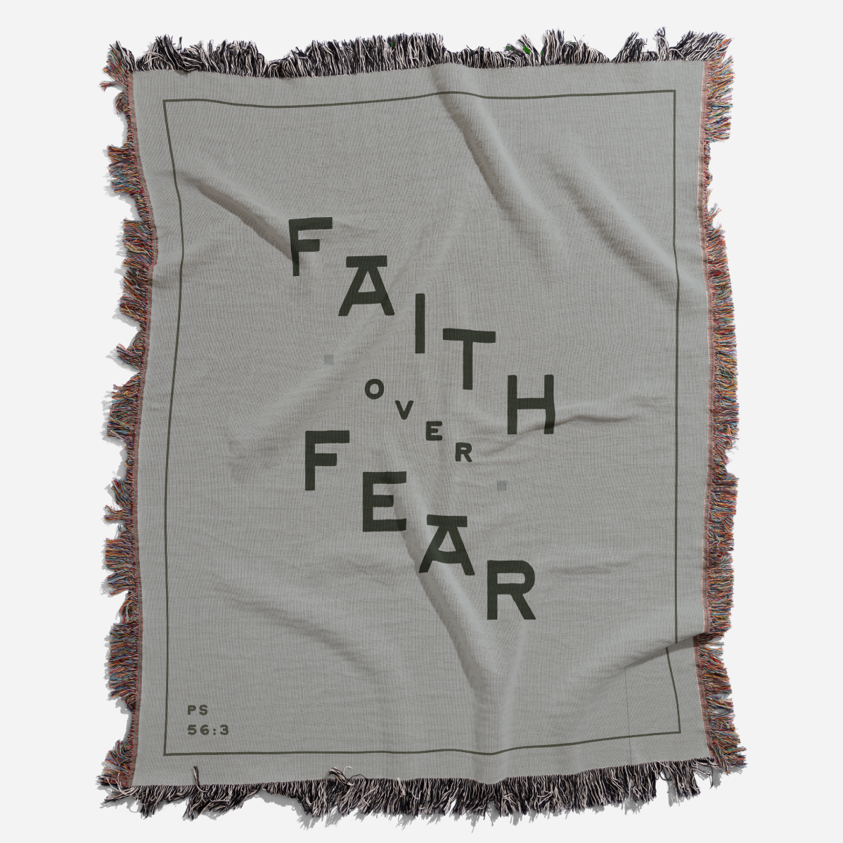 Gray blanket with 'Faith Over Fear' text and fringes on a white background