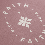 Pink fabric with white floral design and text 'FAITH UPON FAITH' repeated