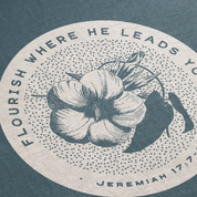 Circular design with floral illustration and text on a blue background