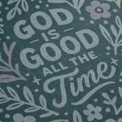 Blue illustrated Christian kids woven blanket with the phrase “God is good all the time”; 100% cotton throw with fringe, perfect for nurseries, nap time, or faith-filled gifting.