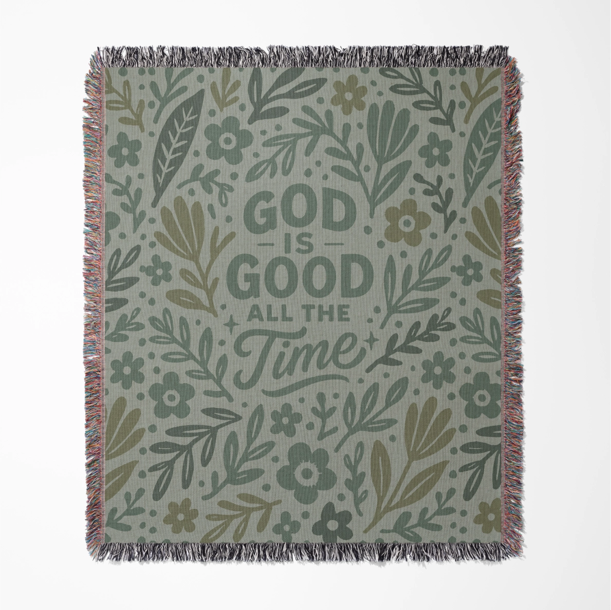 Green illustrated Christian woven blanket for kids with the phrase “God is good all the time”; 100% cotton throw with fringe, perfect for nurseries or faith-based comfort.