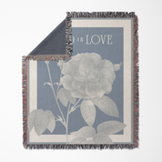 Throw blanket with floral design and 'Love' text on a blue background