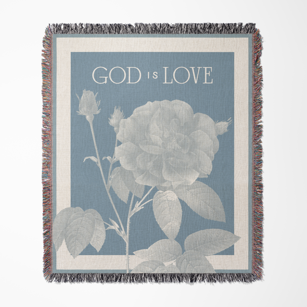 Blanket with floral design and 'God is Love' text on a blue background
