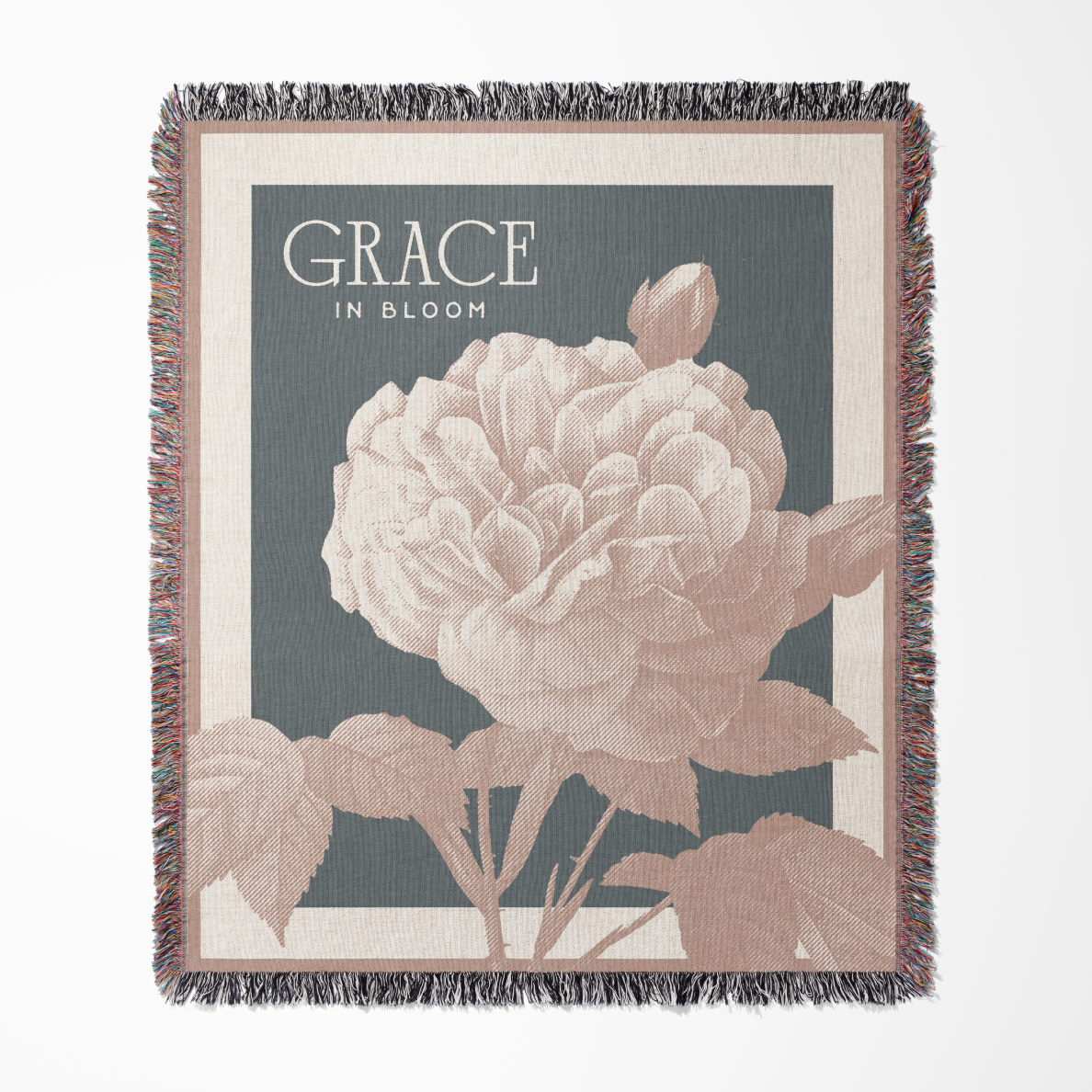 Floral-themed blanket with 'Grace in Bloom' text on a gray background